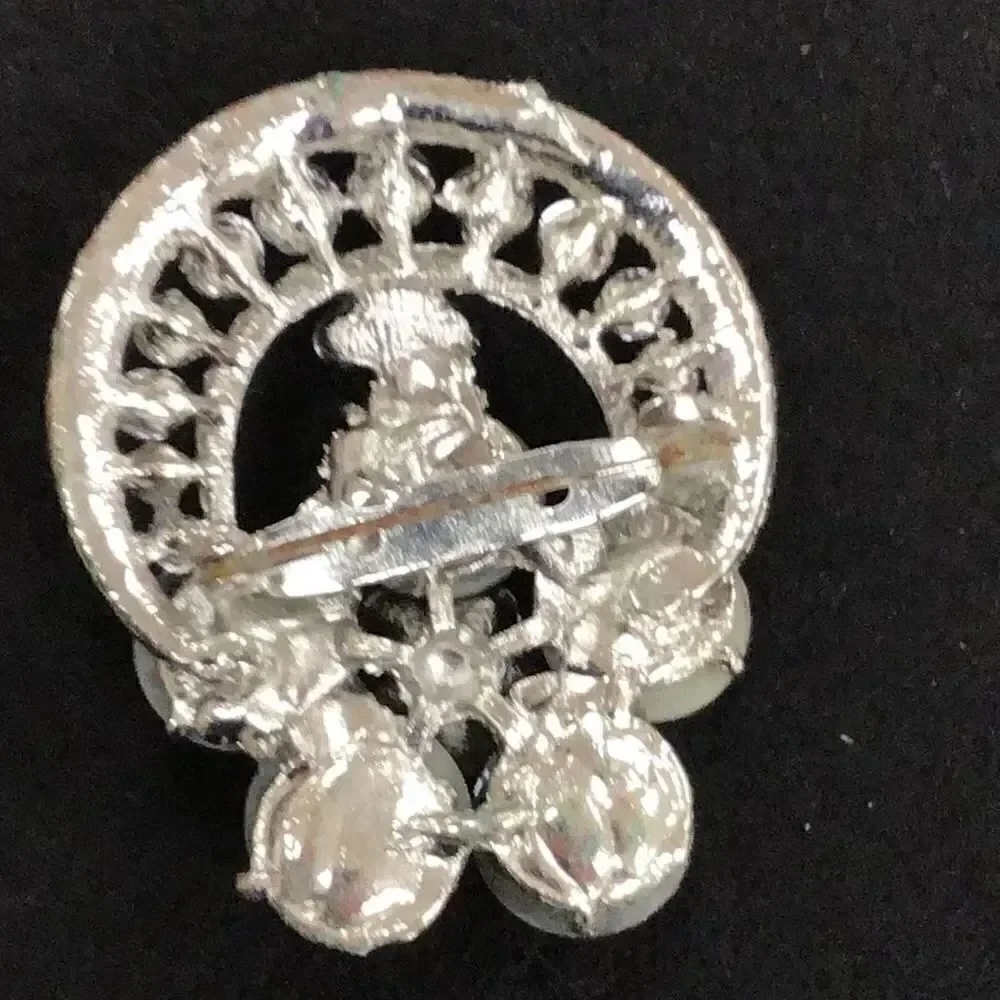 Brooch, vintage rhinestones ￼and white flower shaped